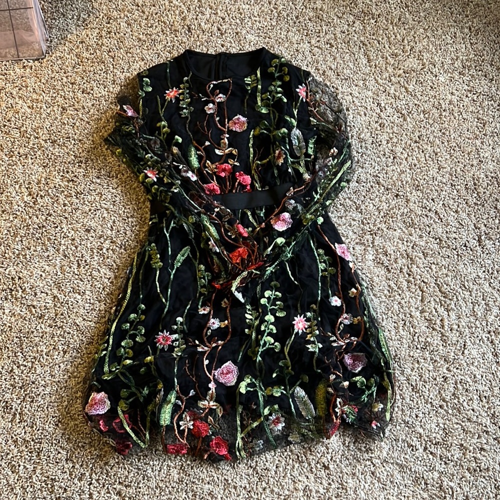 Dress has been worn once the color is like flower vine and black
